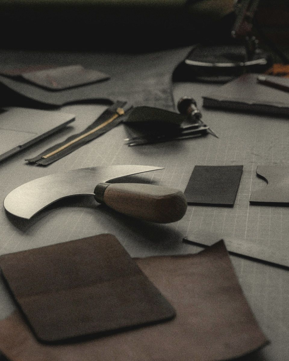 Round knife and leather panels on a cutting table