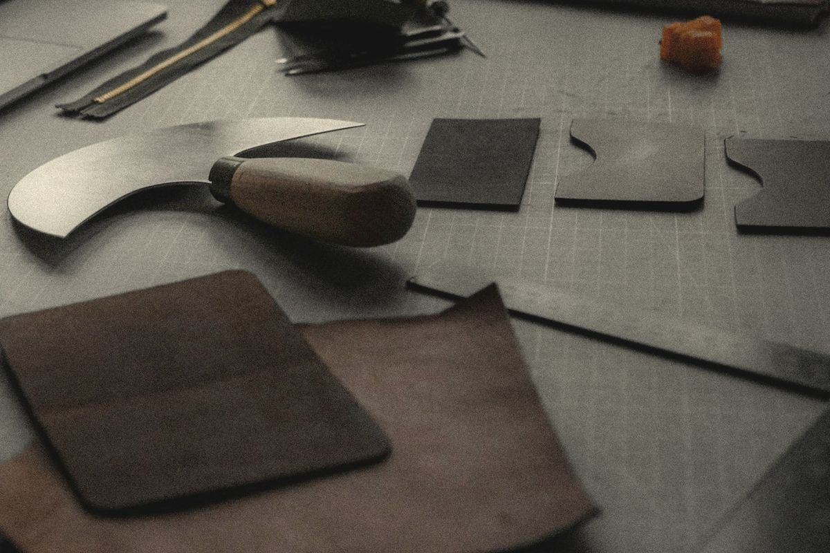 Round knife and leather panels on a cutting table